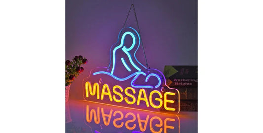 Neon sign with blue outline of a person giving massage and yellow glowing word 'MASSAGE' on reflective surface