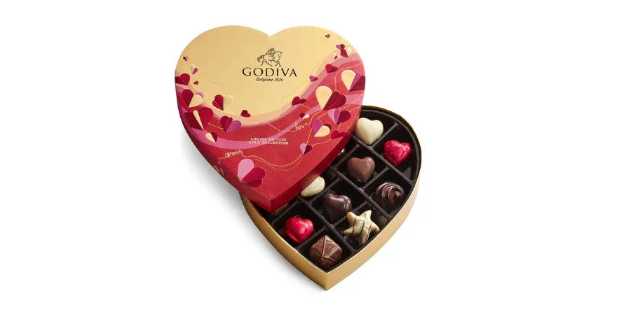 Godiva heart-shaped Valentine's Day chocolate box with assorted heart chocolates and gold packaging