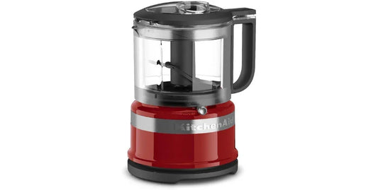 KitchenAid 3.5 cup red food chopper with clear container and black handle on white background