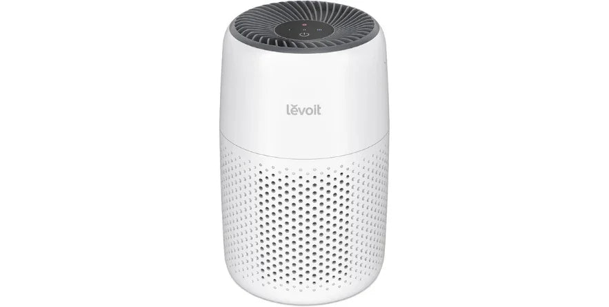 Levoit white cylindrical air purifier with perforated lower section and top control panel