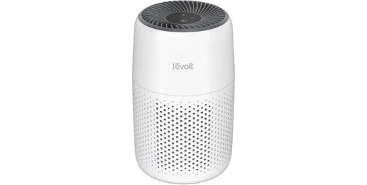 Levoit white cylindrical air purifier with perforated lower section and top control panel