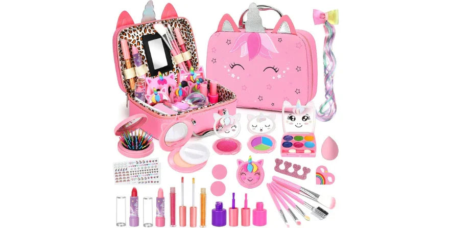 Pink unicorn-themed kids makeup set with brushes, lipsticks, eyeshadows, nail polish, stickers, and hair accessories