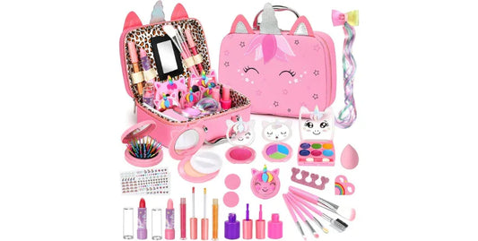 Pink unicorn-themed kids makeup set with brushes, lipsticks, eyeshadows, nail polish, stickers, and hair accessories