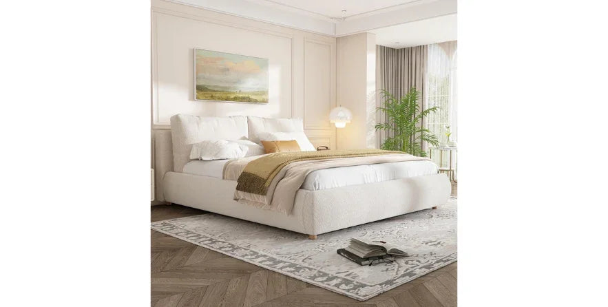 Merax queen size boucle fabric upholstered platform bed in beige bedroom with rug and wall art