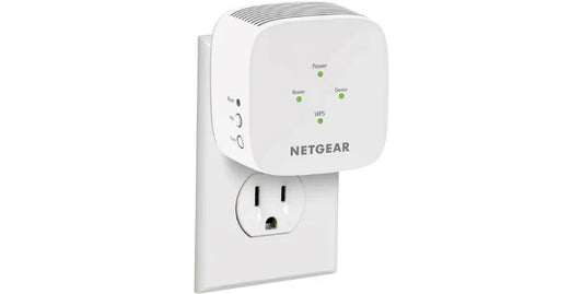 NETGEAR WiFi Mesh Range Extender EX5000 plugged into wall outlet with green indicator lights
